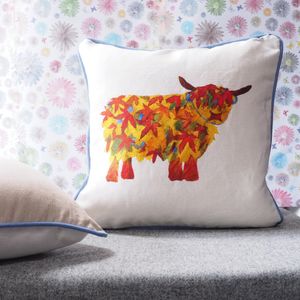 Leaf Highland Cow cushion by Chloe Gardner.