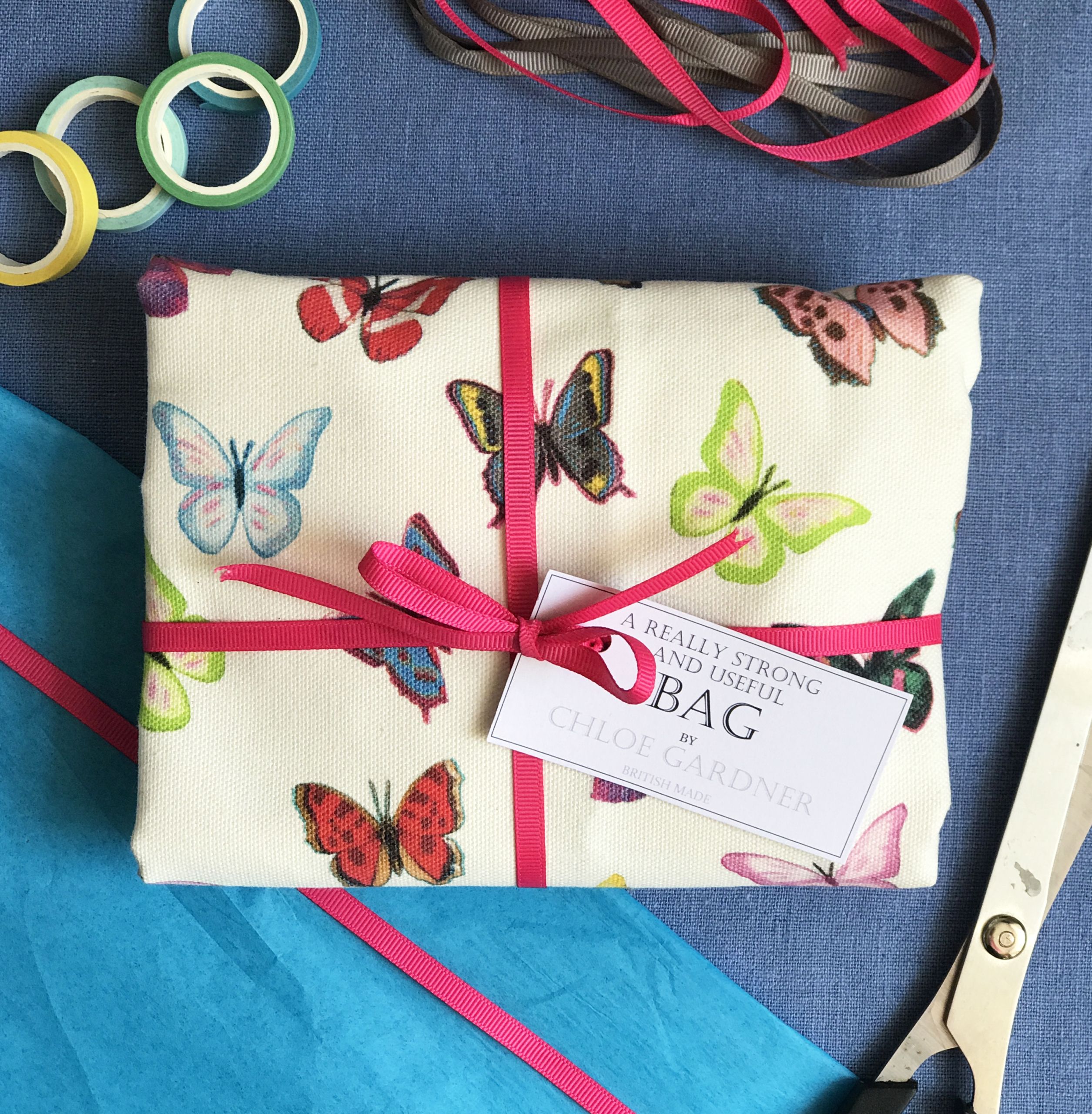 Bag butterflies folded with pink ribbon