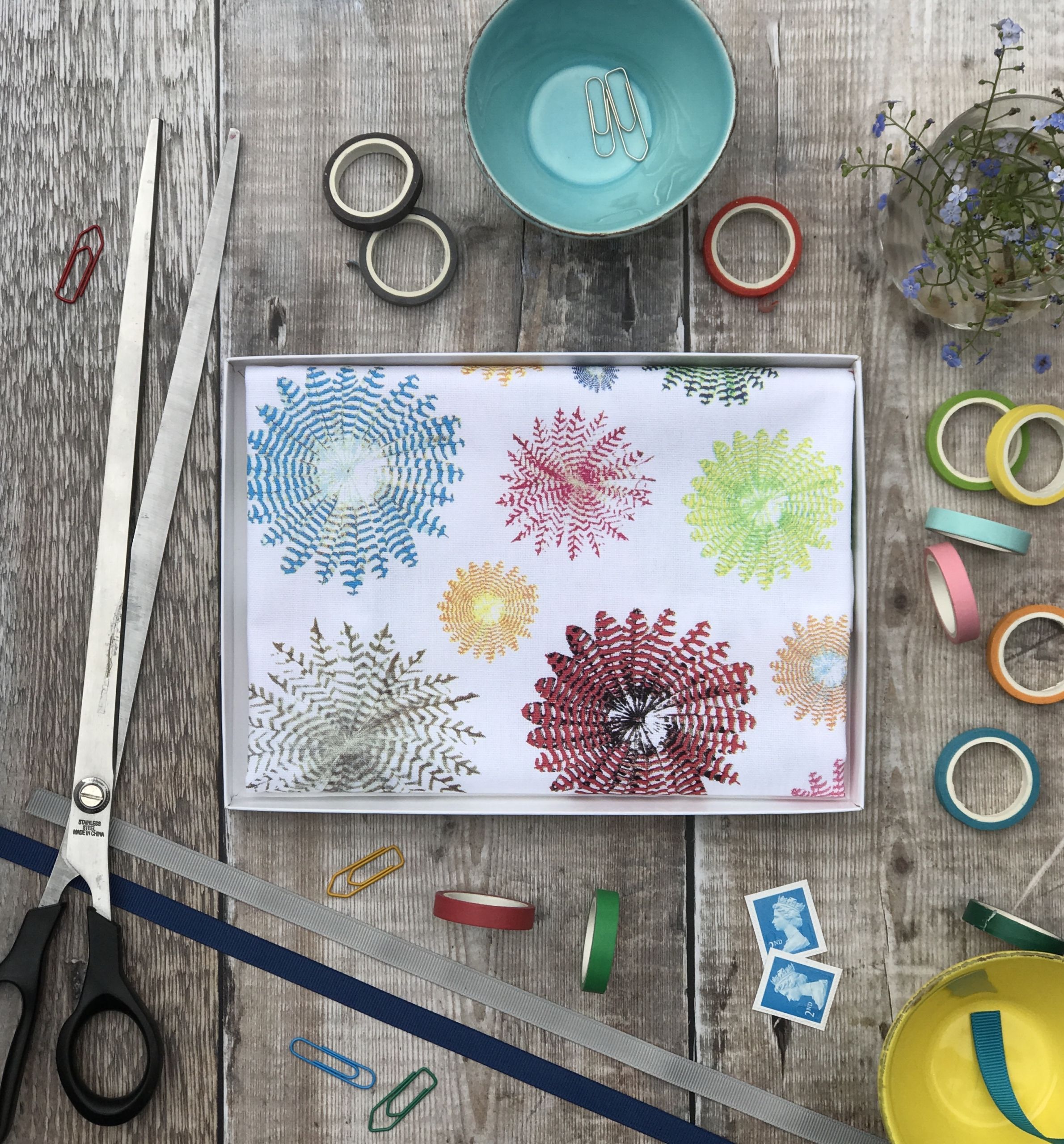 tea towel folded in an open box rounds