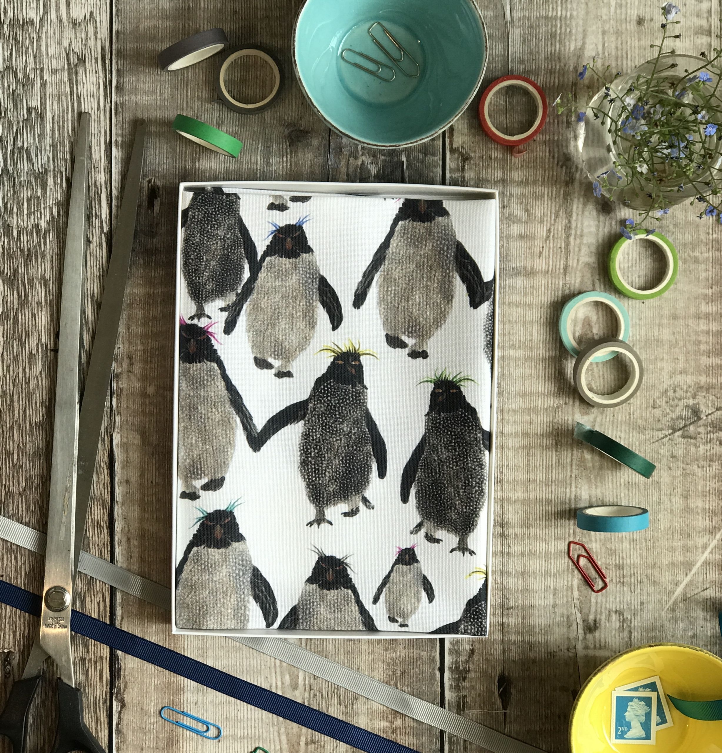 tea towel folded in an open box rockhopper repeat