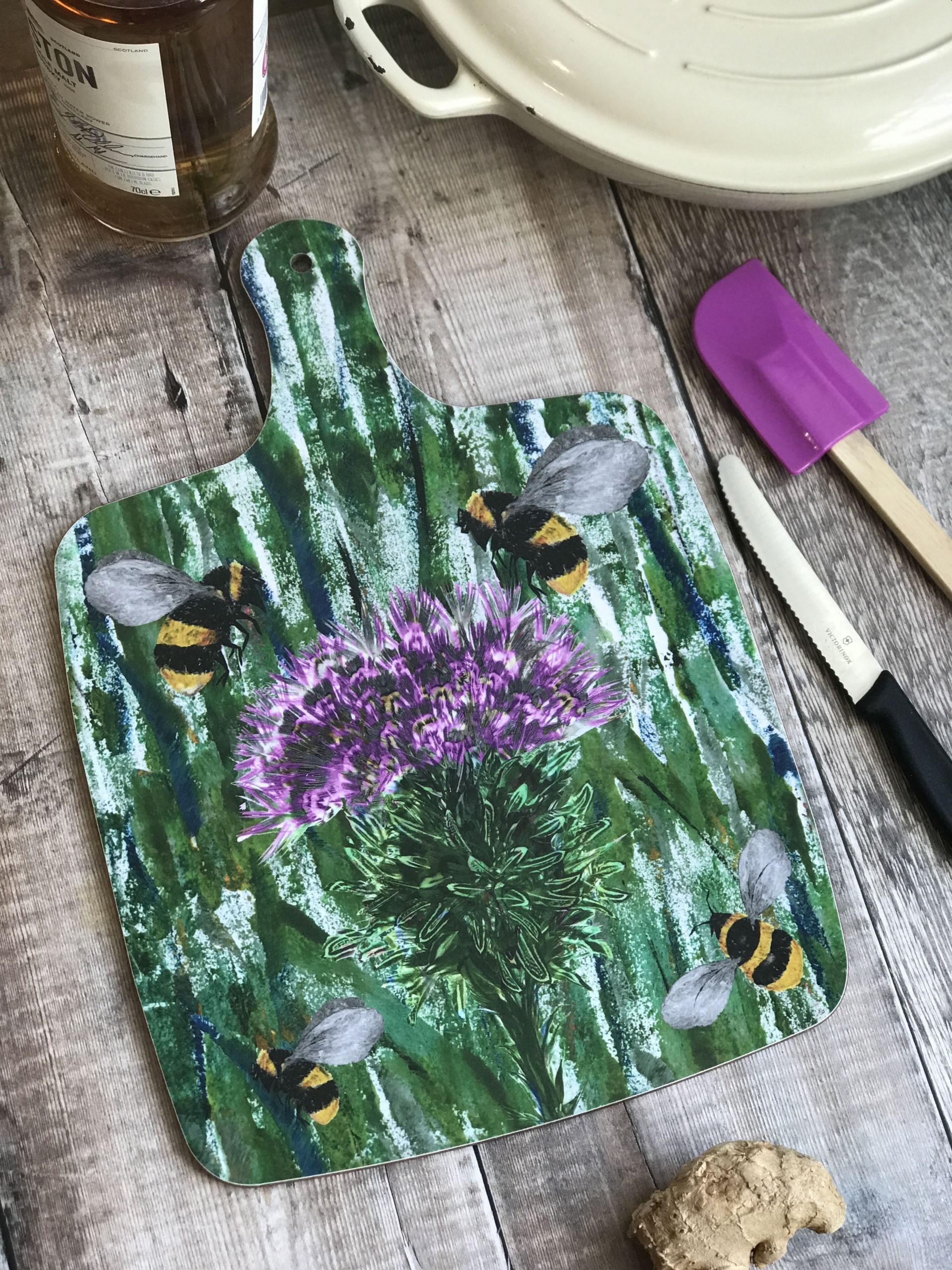 chopping board large bees and thistle close up