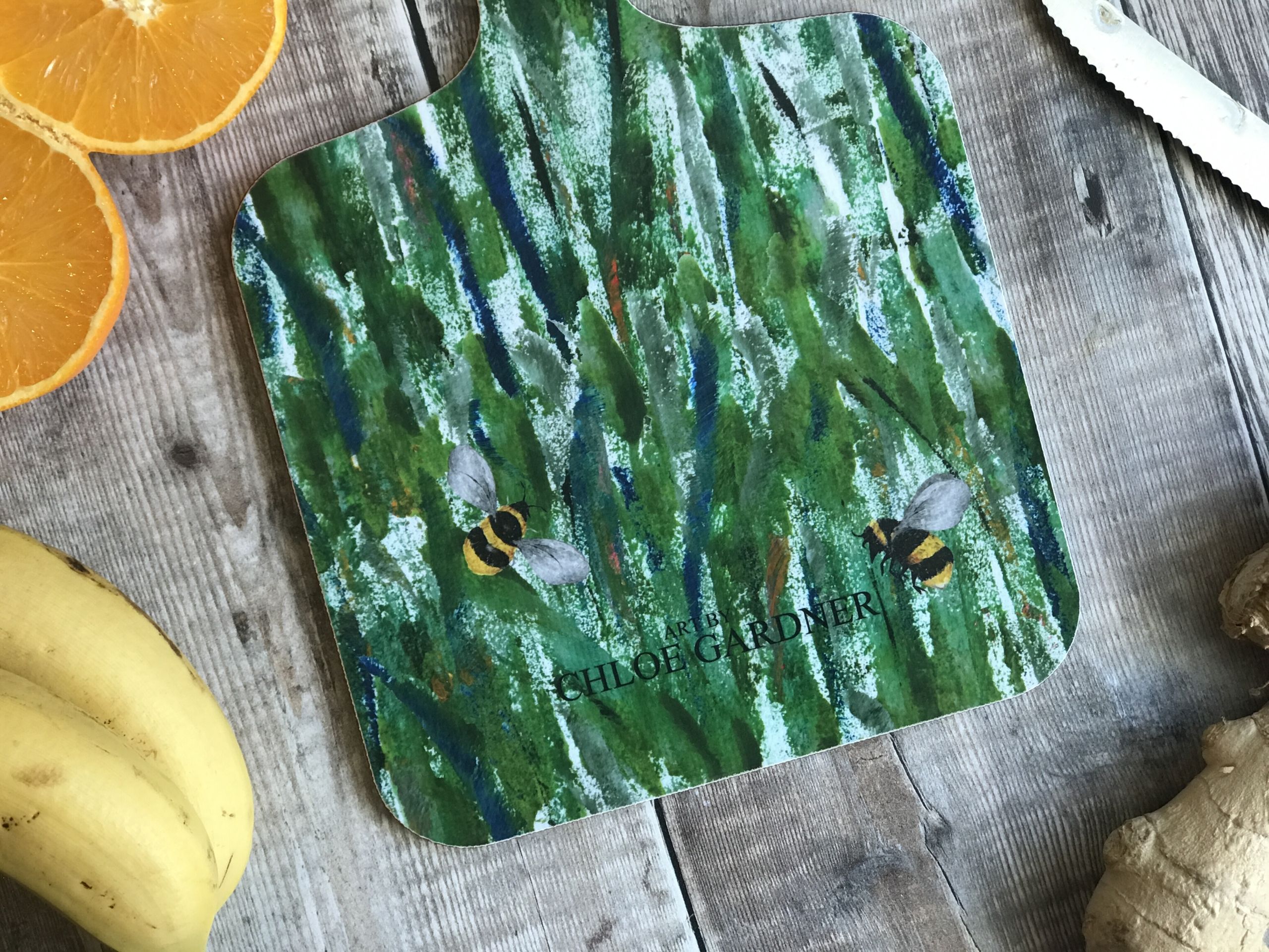 chopping board small bees in grass back close up
