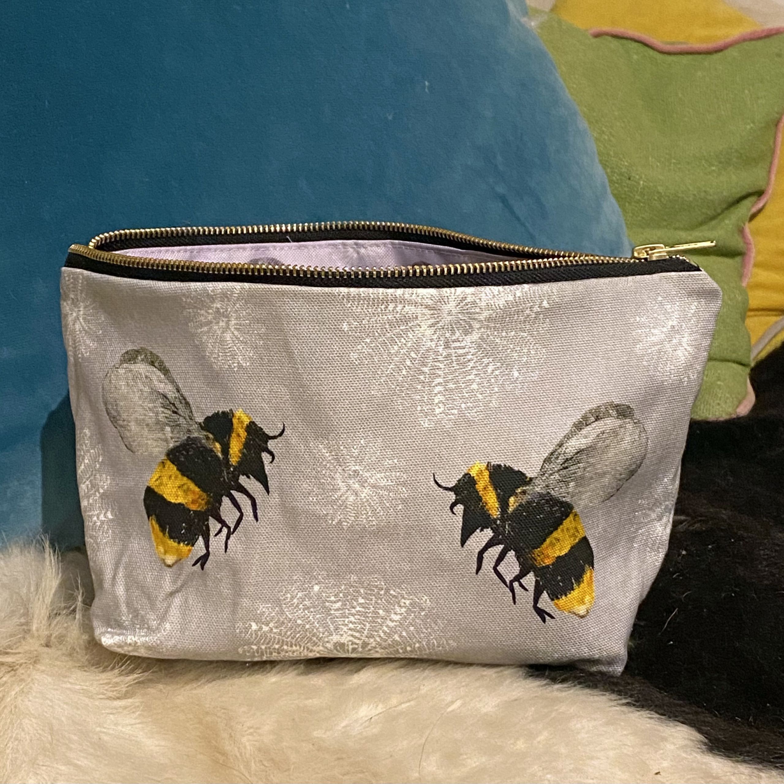 bee and feather flower washbag