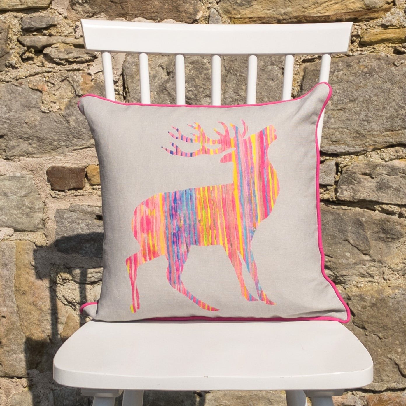 pink stag on grey cushion